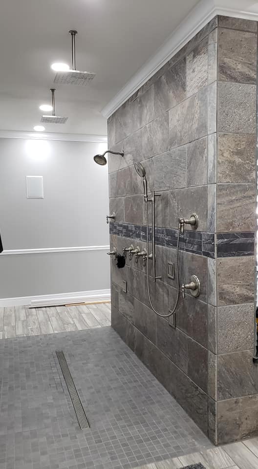 grey slate tile shower with glass doors