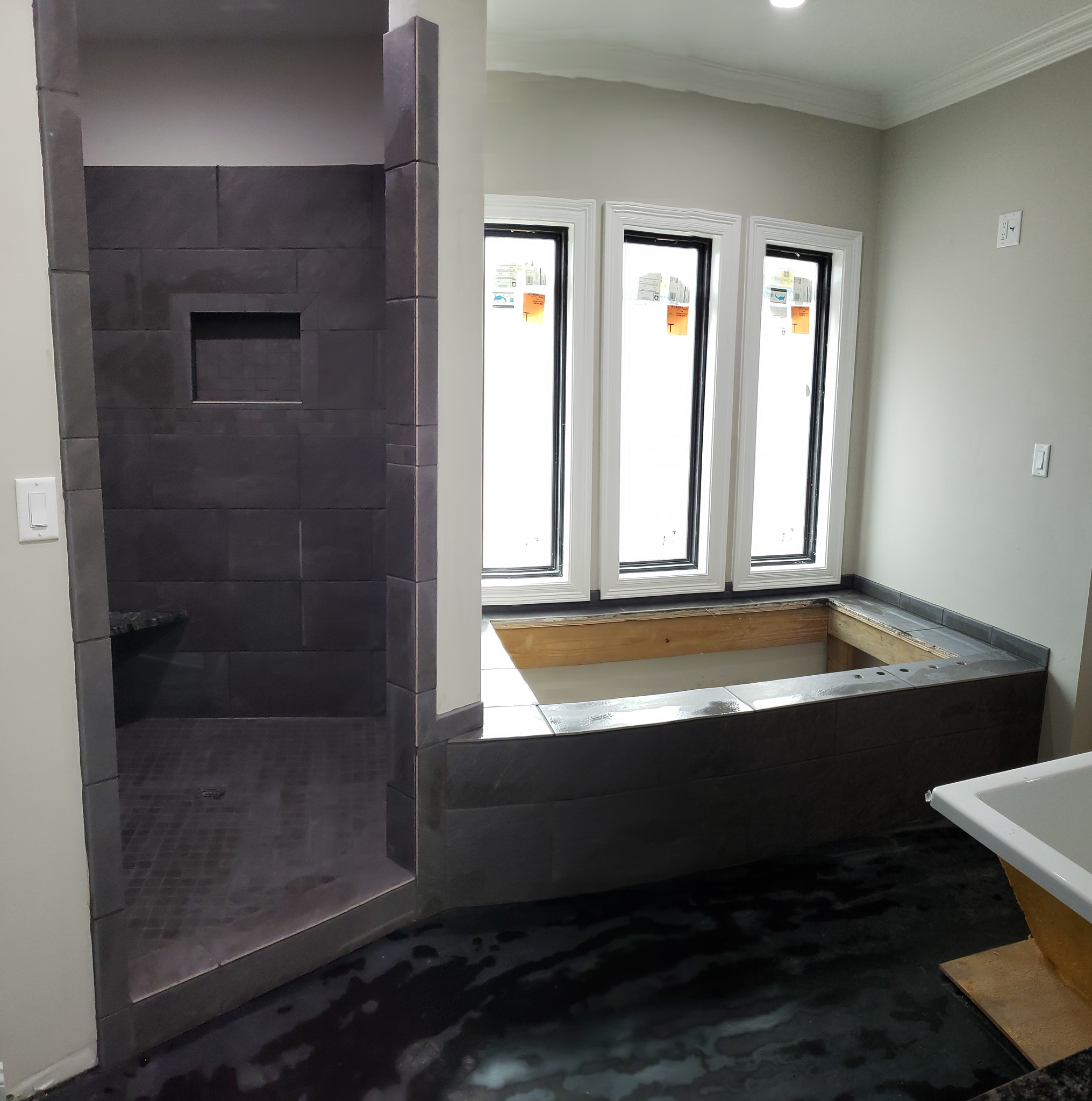 dark grey shower and bathtub tile