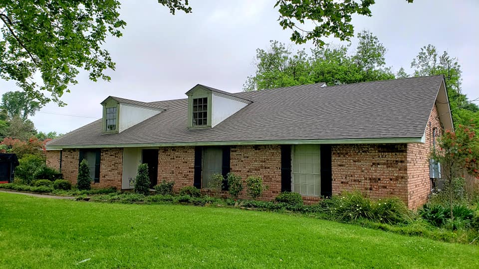 grey shingle roof on brick home